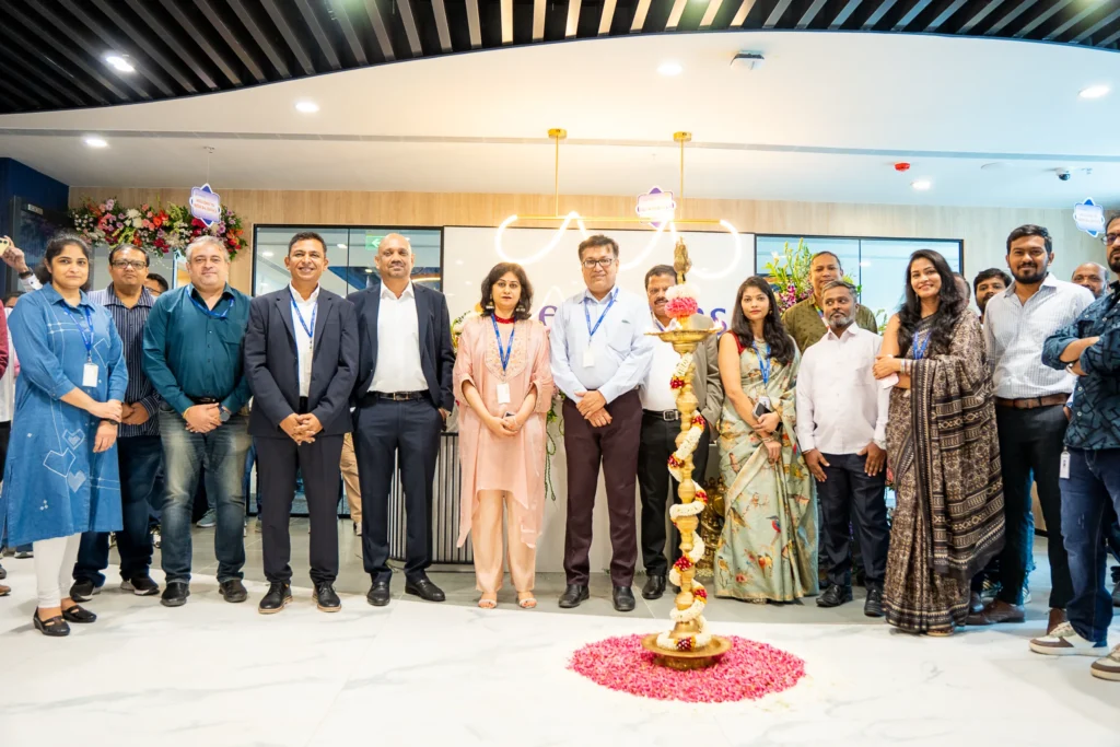Employees posing for a corporate group photo during a conference.